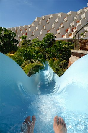 Water slide, feet and hotel. Focus on the feet. Stock Photo - Budget Royalty-Free & Subscription, Code: 400-04556421
