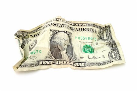 wrinkled one dollar bill over a white surface Stock Photo - Budget Royalty-Free & Subscription, Code: 400-04556529