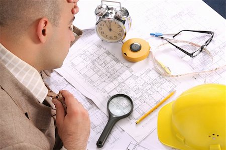 A businessman sleepy with architectural plans at desk Stock Photo - Budget Royalty-Free & Subscription, Code: 400-04556660