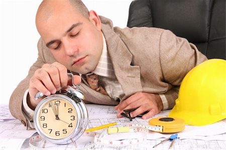 A businessman sleepy with architectural plans at desk Stock Photo - Budget Royalty-Free & Subscription, Code: 400-04556661