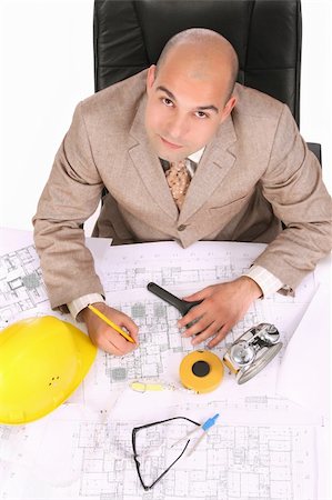 simsearch:400-04552444,k - A businessman happiness with architectural plans at desk Foto de stock - Royalty-Free Super Valor e Assinatura, Número: 400-04556670