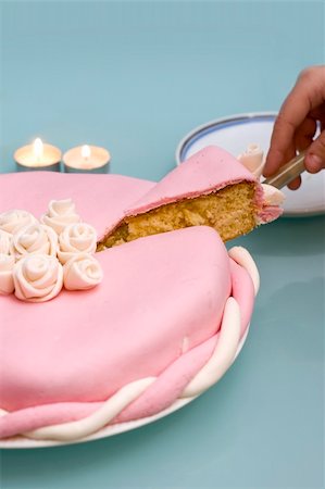 cutting a slice from a fondant cake. Stock Photo - Budget Royalty-Free & Subscription, Code: 400-04557067