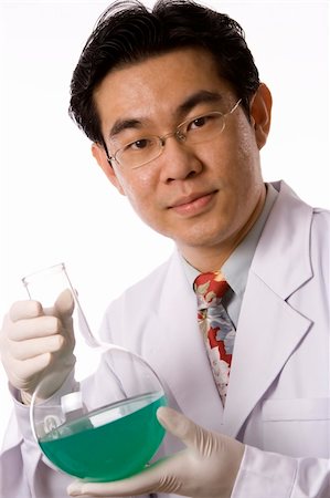 racnus (artist) - Asian doctor with test tube in white background. Fotografie stock - Microstock e Abbonamento, Codice: 400-04557081