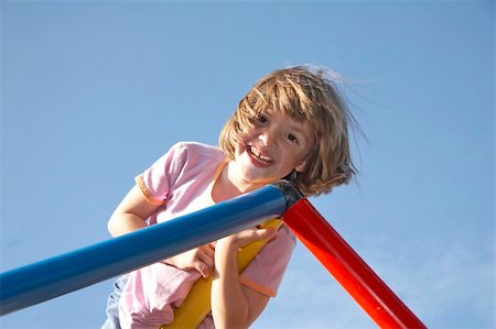 Child playing at a climbing pole Stock Photo - Budget Royalty-Free & Subscription, Code: 400-04557246
