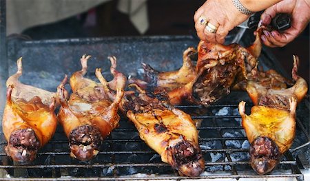 Preparing delicious cuy in Ecuador - Roasted Guinea Pig Photographie de stock - Aubaine LD & Abonnement, Code: 400-04557347