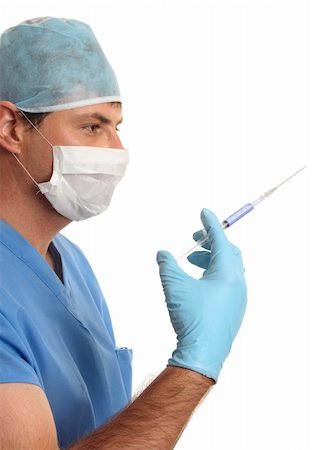 Surgeon doctor holding a disposable syringe with medication or vaccination Stock Photo - Budget Royalty-Free & Subscription, Code: 400-04557359