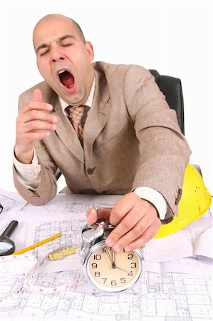 A businessman sleepy with architectural plans at desk Stock Photo - Budget Royalty-Free & Subscription, Code: 400-04557392