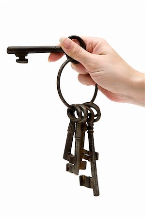 simsearch:400-03909011,k - Female hand holding a bunch of rusty old keys. Isolated on a white background. Stock Photo - Budget Royalty-Free & Subscription, Code: 400-04557424