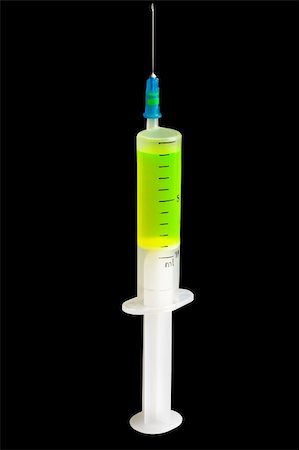 simsearch:400-05240096,k - Syringe with green fluorescent liquid isolated on black. Fotografie stock - Microstock e Abbonamento, Codice: 400-04557516