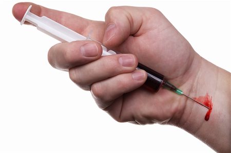 simsearch:400-05240096,k - The man's hand holds syringe and and makes itself an injection. A drop of blood. Isolated on white. Fotografie stock - Microstock e Abbonamento, Codice: 400-04557537