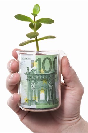 simsearch:400-04557539,k - The hand holds a glass with banknote and sprout. Isolated on white [with clipping path]. Stock Photo - Budget Royalty-Free & Subscription, Code: 400-04557569