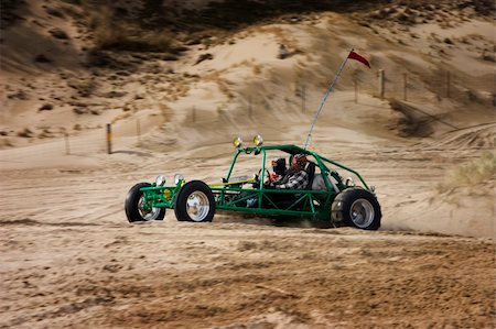 Action shot of a dune buggy (rail car) speeding through the oregon dunes. Foto de stock - Royalty-Free Super Valor e Assinatura, Número: 400-04557719