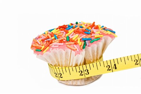 selectphoto (artist) - Cupcake squeezed by measuring tape Stock Photo - Budget Royalty-Free & Subscription, Code: 400-04558196