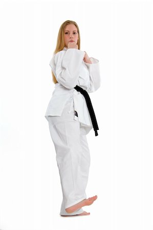 simsearch:400-04014026,k - Black belt female martial artist doing low side kick Fotografie stock - Microstock e Abbonamento, Codice: 400-04558210