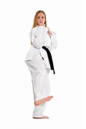 simsearch:400-04014026,k - Black belt female martial artist doing low side kick Fotografie stock - Microstock e Abbonamento, Codice: 400-04558211