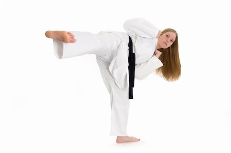 simsearch:400-04558215,k - Black belt female martial artist doing side kick. Photographie de stock - Aubaine LD & Abonnement, Code: 400-04558213