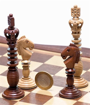 simsearch:400-04955785,k - Two Kings and two knights with coin in center. White background. Stock Photo - Budget Royalty-Free & Subscription, Code: 400-04559428