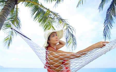 simsearch:862-06542597,k - view of nice woman lounging in hammock in tropical environment Stock Photo - Budget Royalty-Free & Subscription, Code: 400-04559736