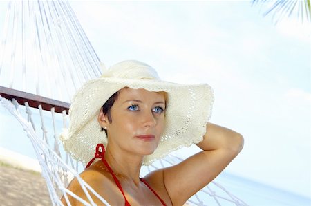 simsearch:862-06542597,k - view of nice woman lounging in hammock in tropical environment Stock Photo - Budget Royalty-Free & Subscription, Code: 400-04559745