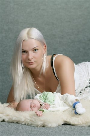 White family - mother takes care about angel like child Stock Photo - Budget Royalty-Free & Subscription, Code: 400-04559754