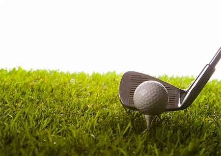range shooting - Golf ball on tee in grass. Foto de stock - Super Valor sin royalties y Suscripción, Código: 400-04550527