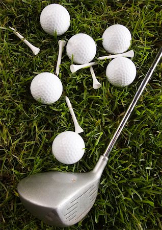 range shooting - Golf ball on tee in grass. Foto de stock - Super Valor sin royalties y Suscripción, Código: 400-04550534