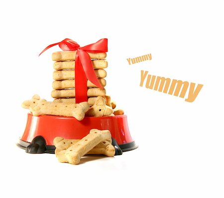 dog christmas background - Dog biscuits in bowl with red bow on white Stock Photo - Budget Royalty-Free & Subscription, Code: 400-04550995