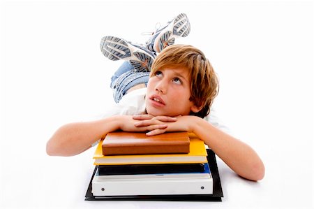 simsearch:400-08429355,k - front view of laying boy with books with white background Photographie de stock - Aubaine LD & Abonnement, Code: 400-04551009