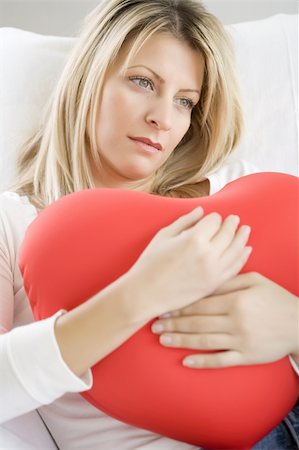 young female dreaming with a big love heart in her hands Stock Photo - Budget Royalty-Free & Subscription, Code: 400-04551028