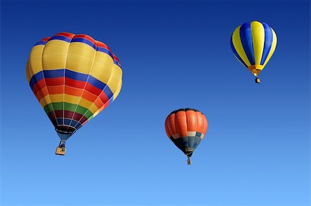 simsearch:400-04180908,k - Colorful hot air balloons against a clear blue sky Stockbilder - Microstock & Abonnement, Bildnummer: 400-04552189