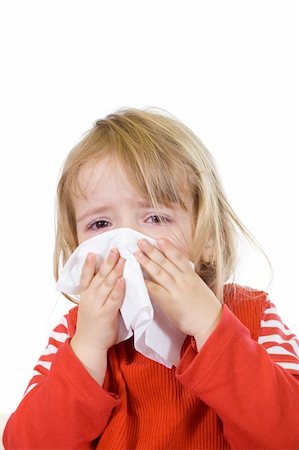 female coughing - Little girl with the flu blowing her nose - isolated Stock Photo - Budget Royalty-Free & Subscription, Code: 400-04552532