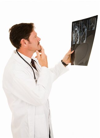 Handsome doctor reviewing the results of a patient's MRI.  Isolated on white. Stock Photo - Budget Royalty-Free & Subscription, Code: 400-04552596