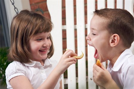 fun preteen models - Sister and Brother Having Fun Eating an Apple Stock Photo - Budget Royalty-Free & Subscription, Code: 400-04552625