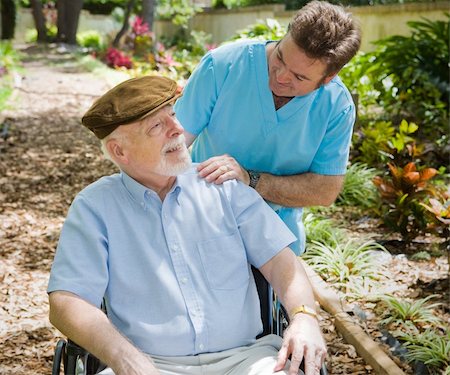 Disabled senior man in the garden with his male nurse. Stock Photo - Budget Royalty-Free & Subscription, Code: 400-04553180