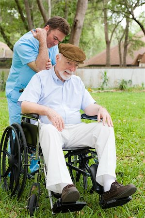 Disabled senior man receiving massage therapy in a lovely outdoor setting. Stock Photo - Budget Royalty-Free & Subscription, Code: 400-04553183