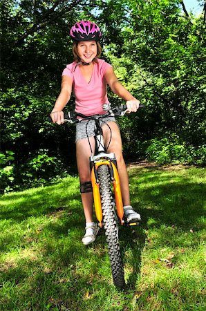 simsearch:400-04890875,k - Portrait of a teenage girl on a bicycle in summer park outdoors Stock Photo - Budget Royalty-Free & Subscription, Code: 400-04553204