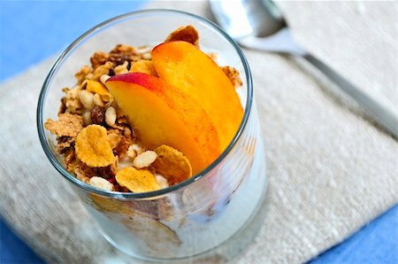 peach slice - Serving of yogurt with fresh peaches and granola Stock Photo - Budget Royalty-Free & Subscription, Code: 400-04553234