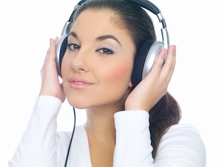 Beautiful young lady is liten to the music, isolated Foto de stock - Super Valor sin royalties y Suscripción, Código: 400-04553522