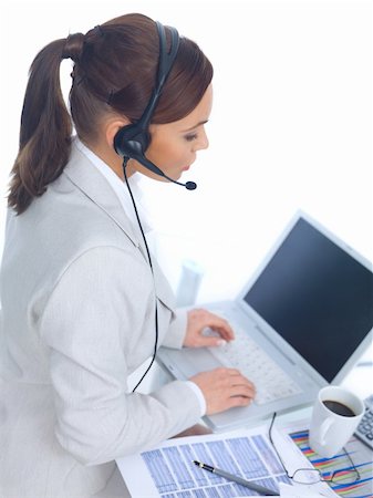 Business woman working in office, wearing headset Stock Photo - Budget Royalty-Free & Subscription, Code: 400-04553574