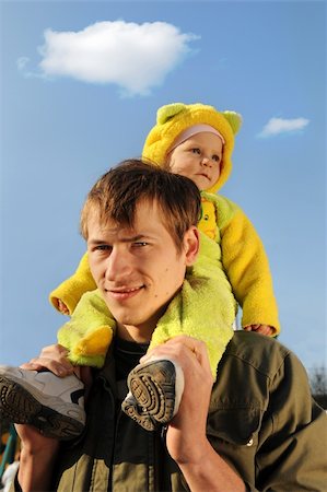Happy father and daughter on a blue sky and clouds Stock Photo - Budget Royalty-Free & Subscription, Code: 400-04564043