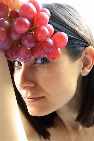 Beautiful young woman with red grape Stock Photo - Budget Royalty-Free & Subscription, Code: 400-04564052