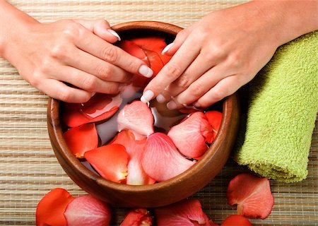 Hands relaxing in bowl of water with rose petals. French manicure. Stock Photo - Budget Royalty-Free & Subscription, Code: 400-04564196