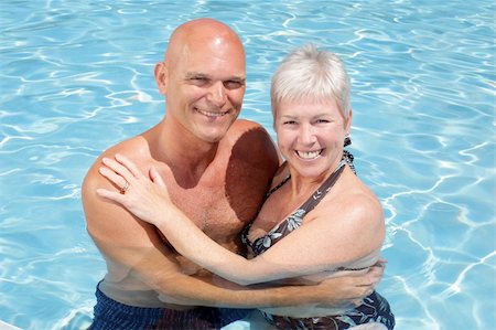attractive couple in the swimming pool enjoying holidays together Stock Photo - Budget Royalty-Free & Subscription, Code: 400-04564479