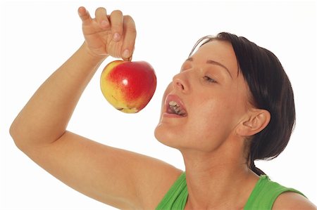 simsearch:400-04564926,k - attractive brunette woman with apple on white background Photographie de stock - Aubaine LD & Abonnement, Code: 400-04564673