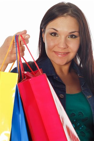 simsearch:400-07318724,k - attractive brunette woman with shopping bags on white background Fotografie stock - Microstock e Abbonamento, Codice: 400-04564930
