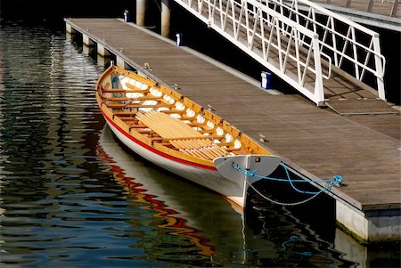 escaler - A view of a gondola or wooden longboat tied to a dock in the city center of Cork, Ireland. Foto de stock - Royalty-Free Super Valor e Assinatura, Número: 400-04565688