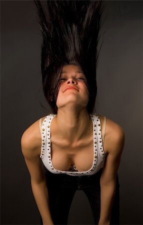 Beautiful girl shaking her head isolated on black background Stock Photo - Budget Royalty-Free & Subscription, Code: 400-04566040