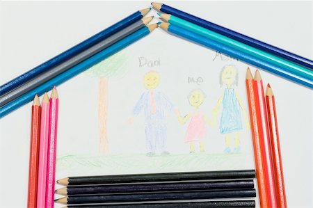 Multicolored pencils at a white paper with a child's family picture Stock Photo - Budget Royalty-Free & Subscription, Code: 400-04566144