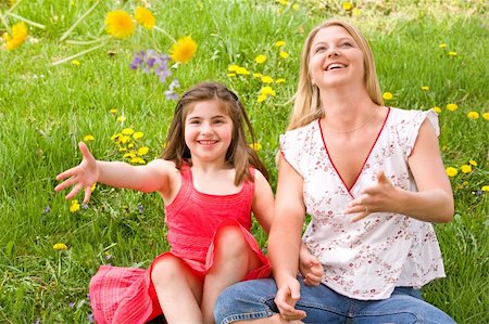 Mom and Daughter Throwing Flowers Having Fun Stock Photo - Budget Royalty-Free & Subscription, Code: 400-04566748