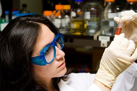 Scientist is checking the color change of a reaction in a test tube Stock Photo - Budget Royalty-Free & Subscription, Code: 400-04567157